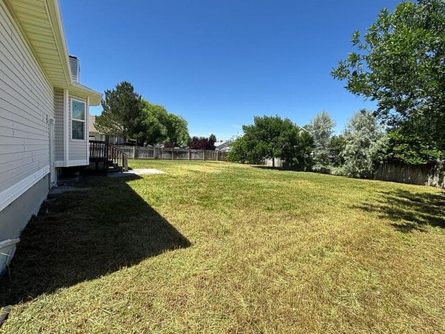 Building Photo - Spacious 5-Bedroom Home in Stansbury Park ...
