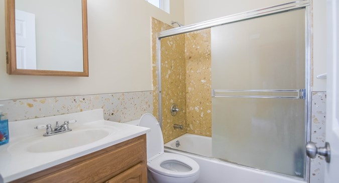 Full bathroom with stone tiling - 267 Irvington Street