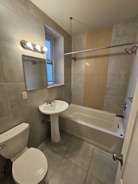 Deep Bathtub. Window and Porcelain walls and floor. - 3832 Baring St