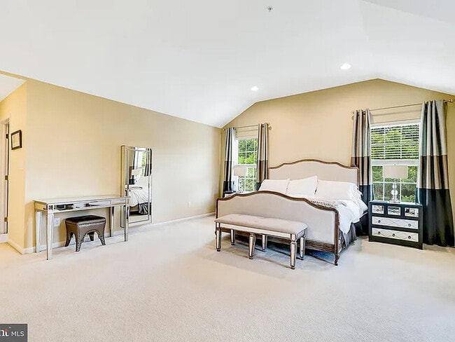 Building Photo - A stunning end-unit carriage home with an ...