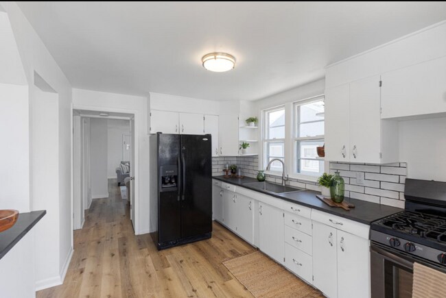 Building Photo - Updated South Omaha Home with Oversized Ga...