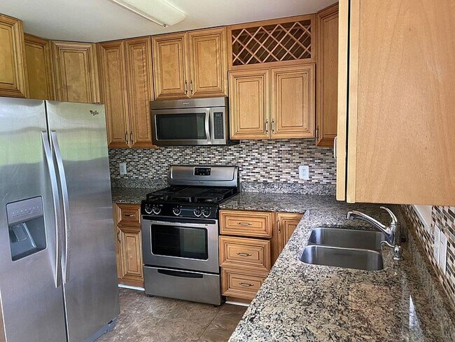 Building Photo - Spacious 5BR/2BA Single Family | Fresh Paint + New Carpet | New Kitchen Floor | Huge Yard + Deck