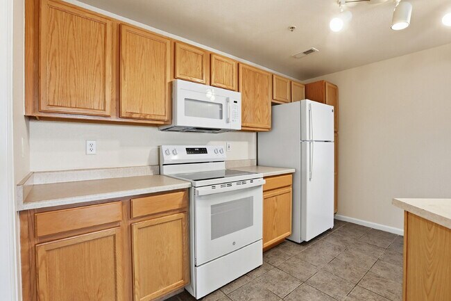 Building Photo - $1,690.95, 2-bed, 2-bath condo in a gated community with a washer/dryer.