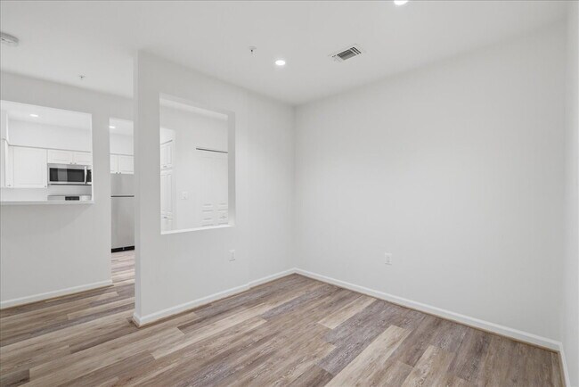 Building Photo - Commuter’s Paradise! Ground-Level 2BR Condo  Welcome home to this stunning, sun-filled 2-bedroom ...
