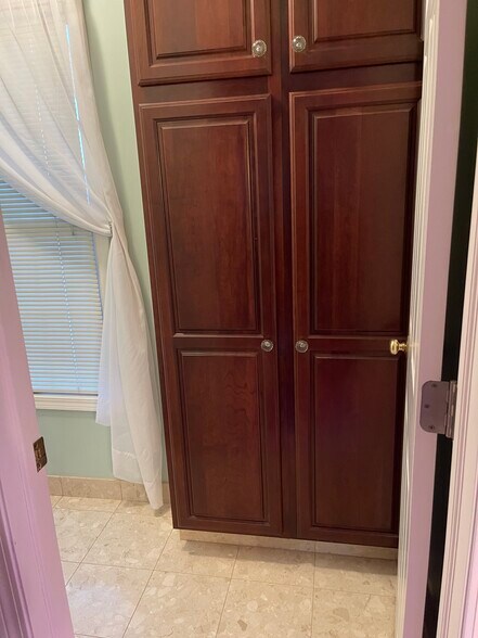 Master bath storage - 6349 Woodhall Ct