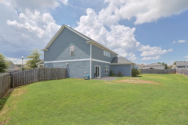 Building Photo - 4BR/3.5BA · 2,809 SF · Owner's Suite on Main · Fenced Yard · Midland, GA — $2,800/mo