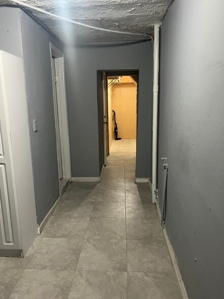 Hallway leads you to restroom & bedroom.. - 1030 NW 120th St
