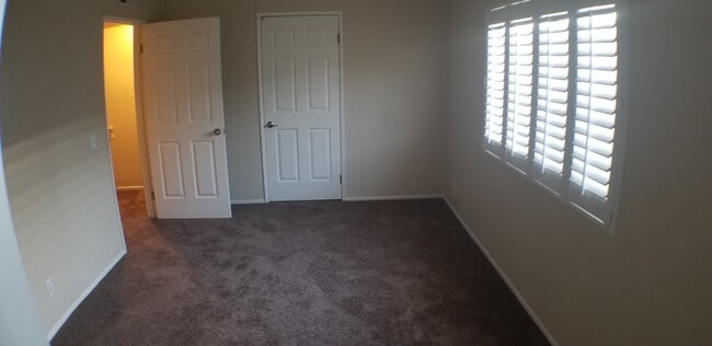 2nd Bedroom with walk-in closet. NOTE: Carpet shown is not actual color. New carpet color is Stee - 14365 Foothill Blvd