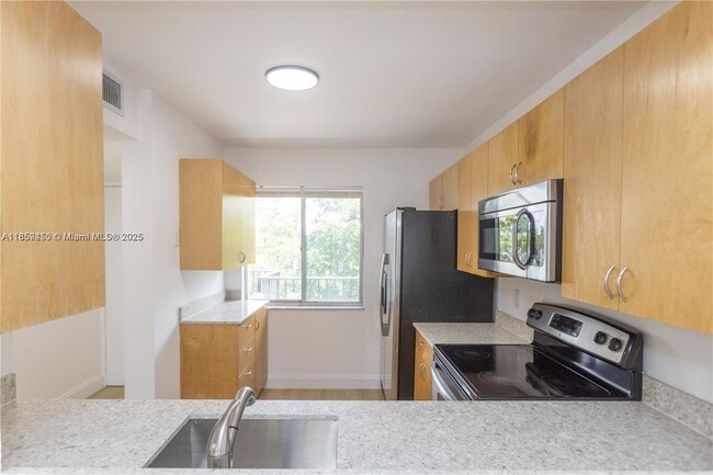 Building Photo - $2,100MONTHLY;8740 N SHERMAN CIR. #408 MIR...