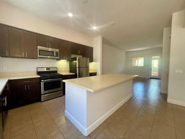 Building Photo - 3 Bed/3 Bath, 2 Garage & 2 Balconies Gated...