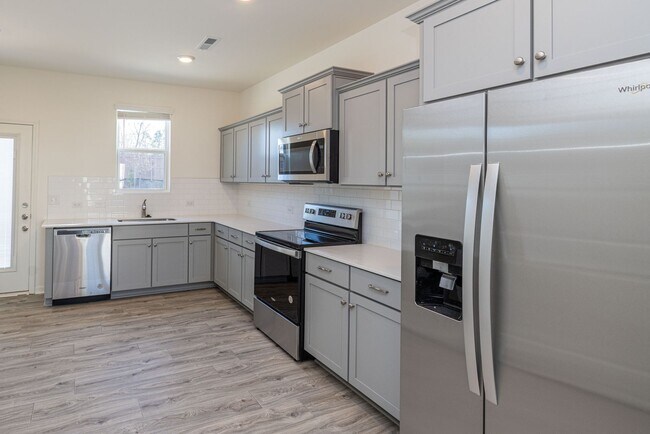 Building Photo - 3 Bedroom Townhome Minutes from Downtown Oakboro - Available August 2026