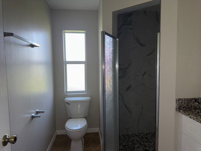 Building Photo - Experience this Cape Coral 3 bedroom 2 bath corner duplex with 1 car garage and screened in lanai.