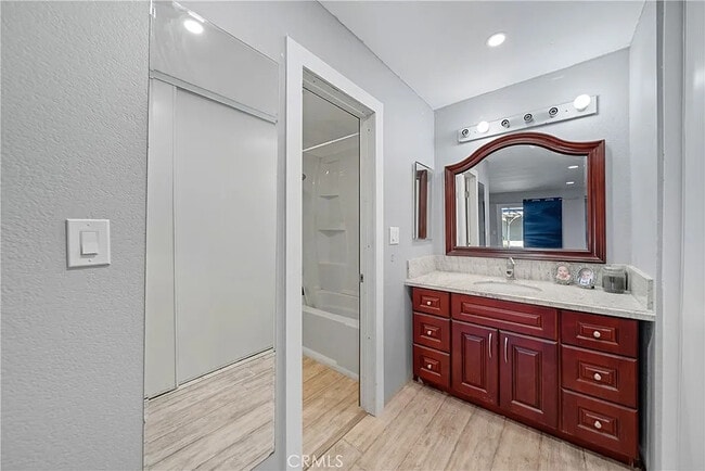 Building Photo - Bright 2-Bed Condo with Central Air, Pool Access & Carport in Anaheim