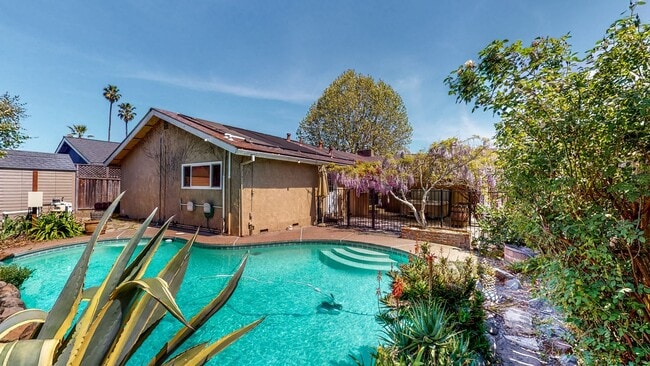 Building Photo - PURE Property Management - Stunning four-b...