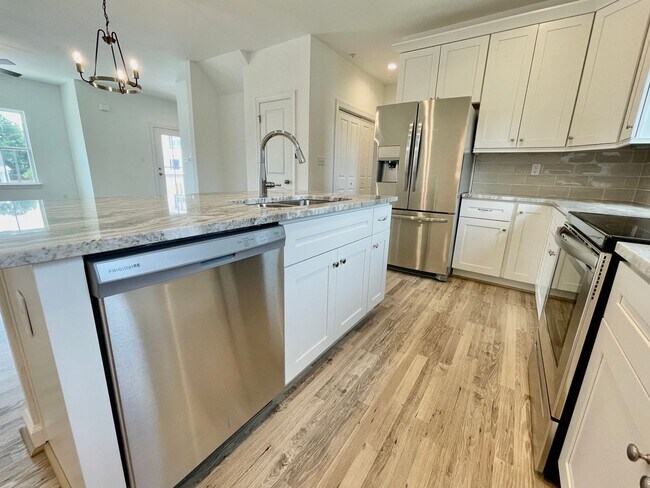 Building Photo - Practically New & Available NOW! Americana Luxury Townhomes! Pet Friendly! Attached Garage! All A...