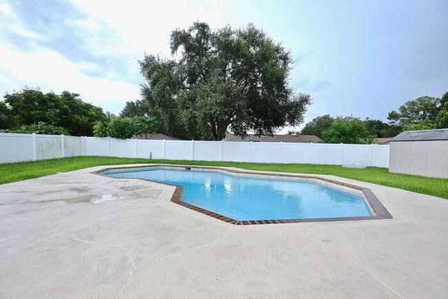 Building Photo - Gorgeous 4/2 Pool Home with a Covered Patio and a Large Fenced Backyard Located in Dr. Phillip's ...