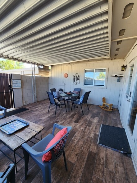 Tiled and covered gated patio. Gae leads to 3 reserved and covered parking spaces. - 5050 N 81st St