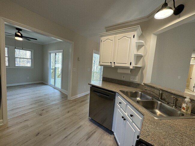 Kitchen and sunroom - 8017 Pine Oak Rd