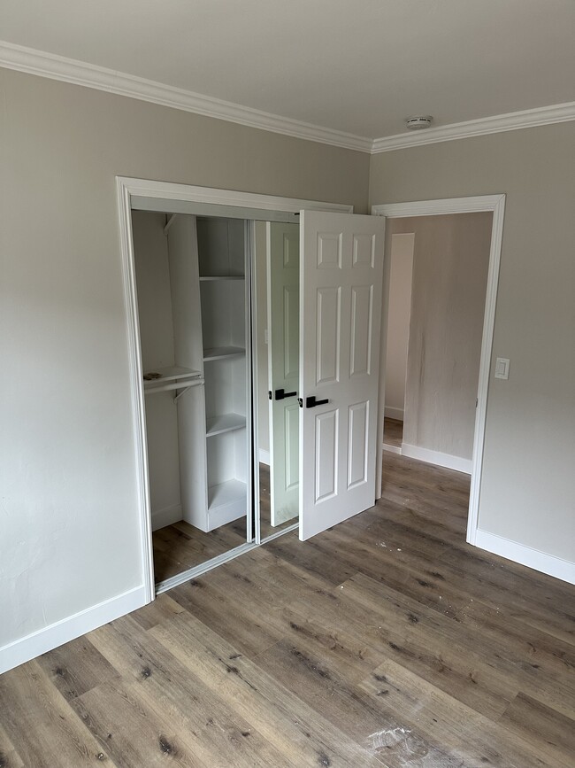 Bedroom #3 with large closet, ceiling fan, lighting, and flooring - 4230 W 169th St