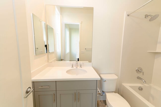 Building Photo - Experience contemporary urban living at its finest. Private Garage & Dual Suites!