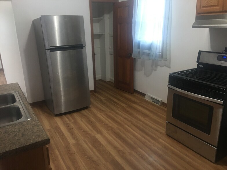 Kitchen looking from porch entrance - 911 S Carpenter St