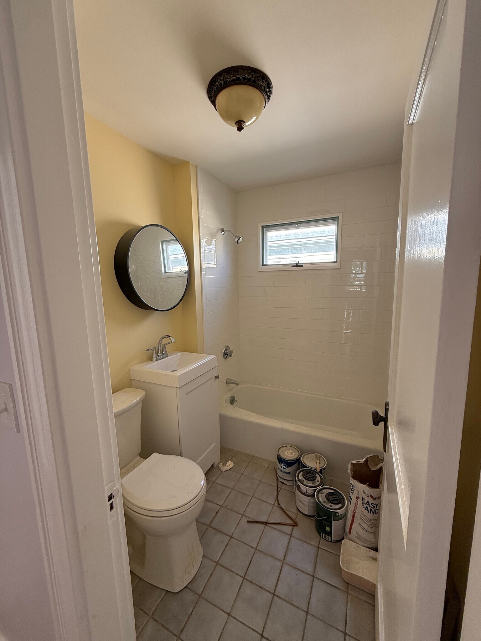 Bathroom with new toilet, vanity, tub, and tile. Excuse the mess! It will be cleaned. - 27 Seven Pines Ave