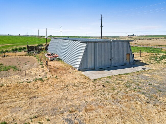 Building Photo - Country Living with a Huge Shop - 3BR on Acreage, Livestock Welcome!