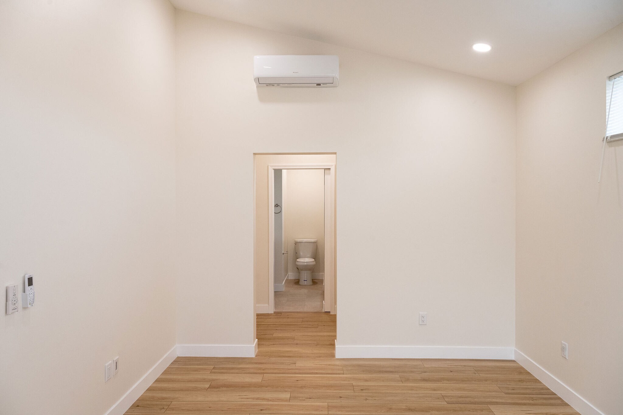 Primary bedroom with view to primary bath - 4774 Bancroft St