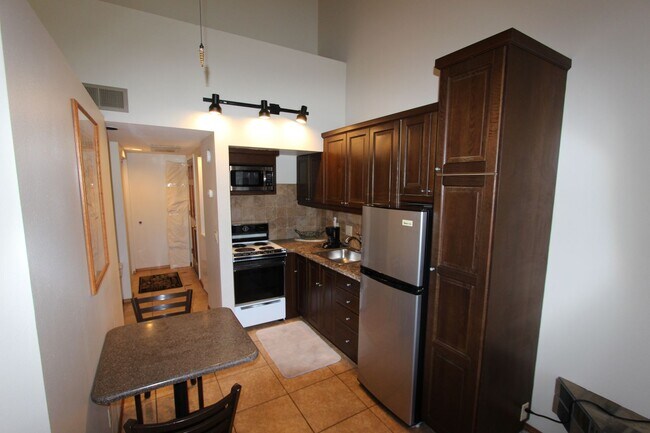 Building Photo - Furnished Country Club Condo | Private Balcony + Golf Course Views