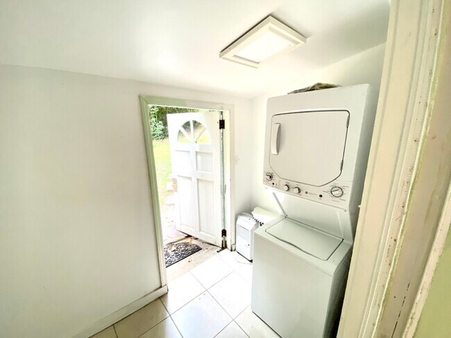 Front entrance from inside, stackable laundry unit - 95 Lanier St