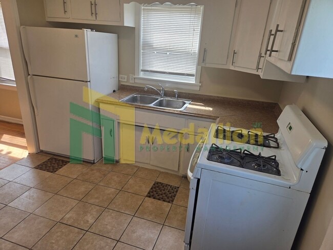 Building Photo - Spacious 4-Bedroom Home with Finished Basement and Yard Space