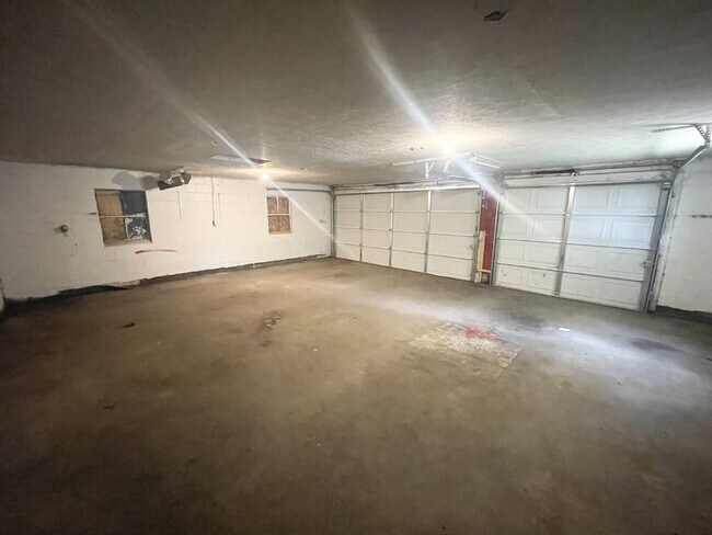 Building Photo - HUGE, 3-car garage/workshop combo (has electricity)