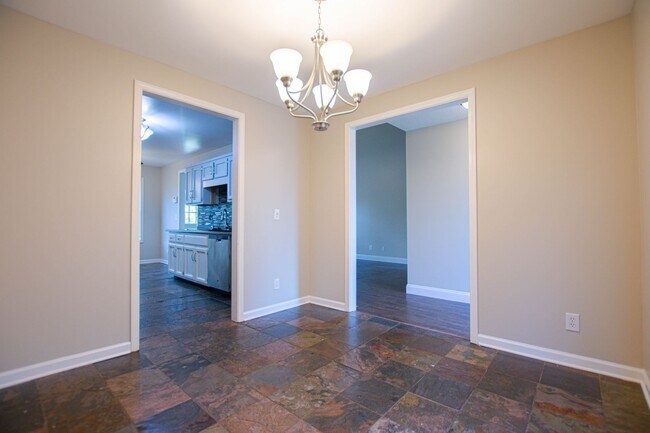 Building Photo - Pet Friendly Three Bedroom with Bonus!