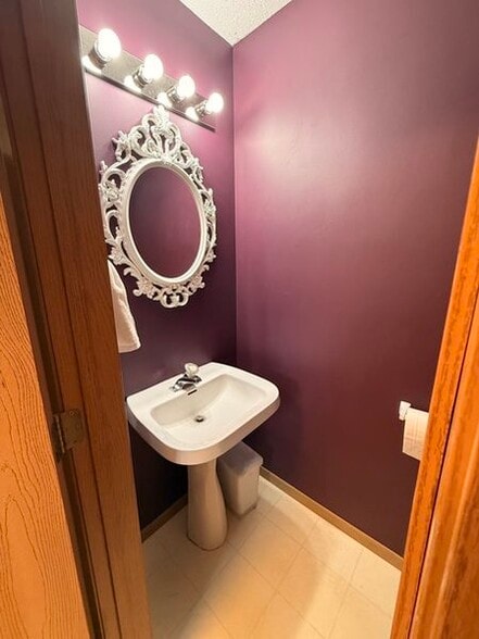 Half bath off kitchen - 7013 Quantrelle Ave NE