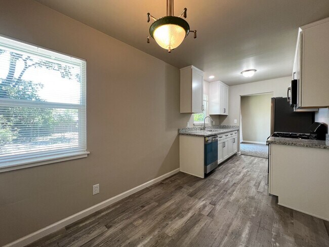 Building Photo - Freshly Renovated 3 Bedroom Home with Large Fenced Yard & Double Garage