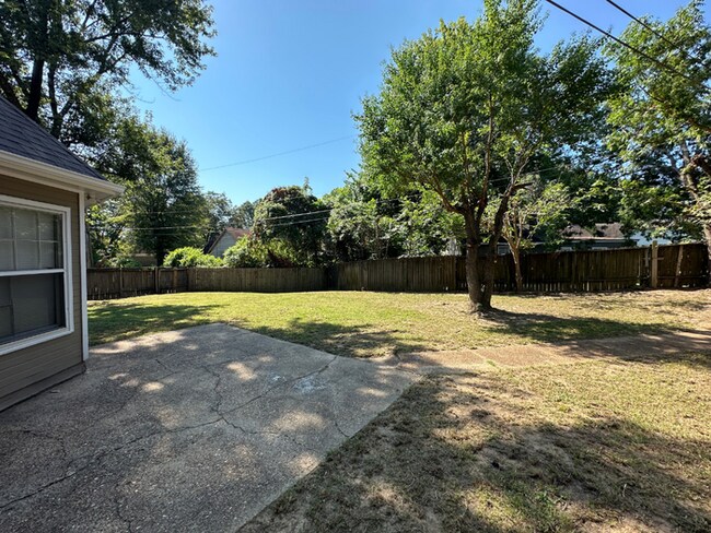 Building Photo - Charming 3BR/2BA Near Southwind | Hardwood Floors, Brick Fireplace, Bay Window & 2-Car Garage