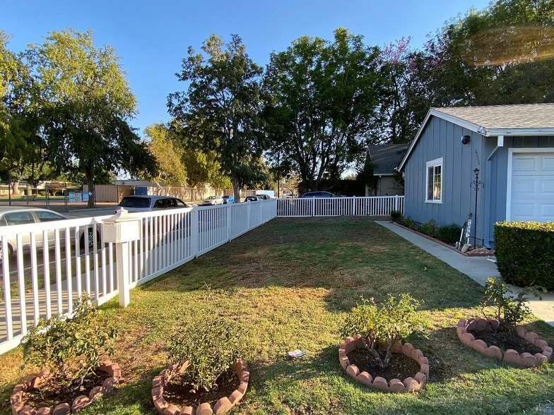 Front Yard with fencing - 6565 Vicky Ave