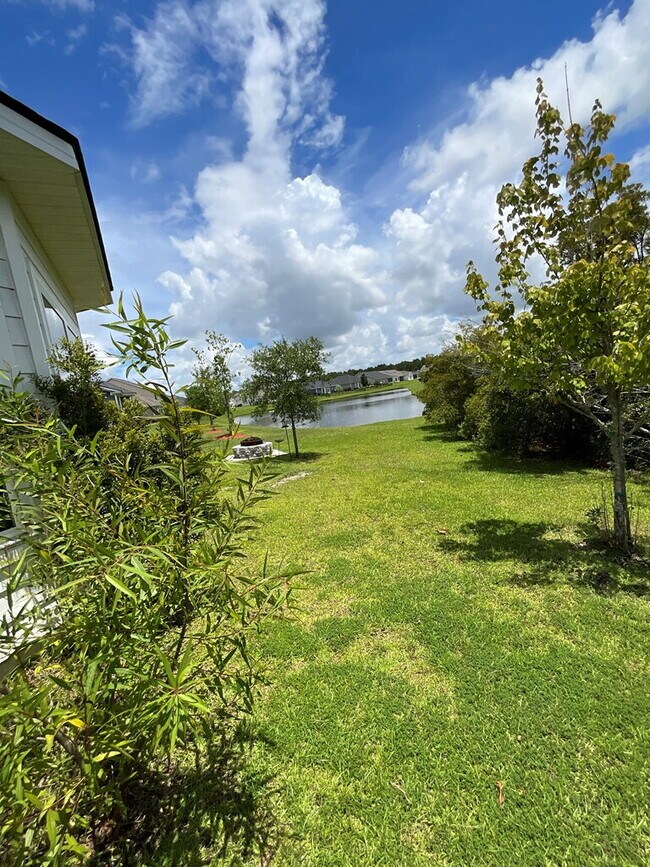 Building Photo - "Spacious 4-Bed Oasis with Stunning Lake V...