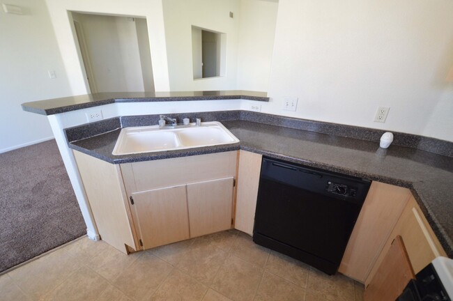 Building Photo - 2nd Floor Condo in a Gated Northeast Commu...