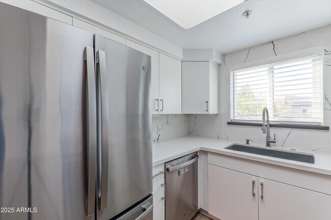 Building Photo - 9450 E Becker Ln