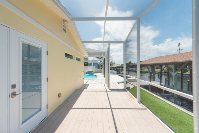 Building Photo - Live the ultimate Space Coast waterfront lifestyle at this stunning beachside canal home in Satel...