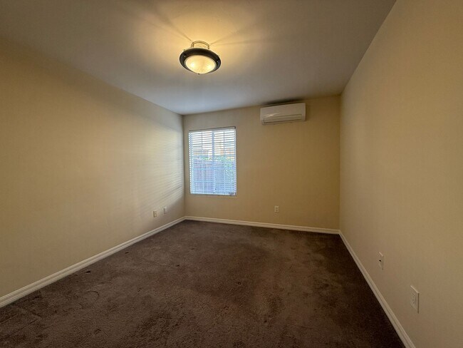 Building Photo - Upgraded Condo with Private Patio, AC, Pool, Gym, and Covered Parking in Gated Community