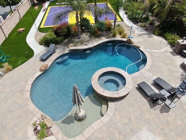 Building Photo - Spacious 5-Bedroom Luxury Home with Entertainer’s Backyard Oasis