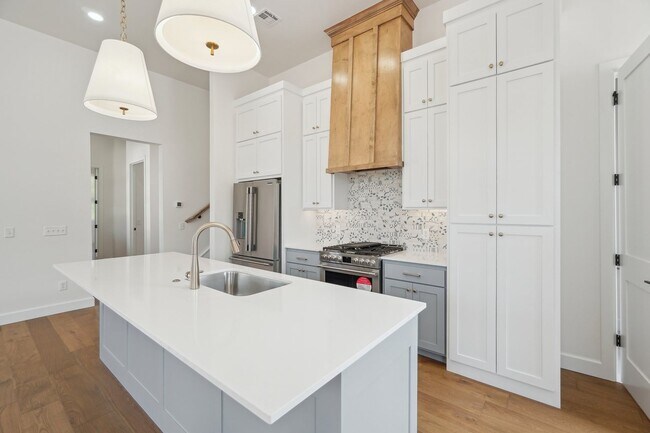 Building Photo - Classic Cape Cod Meets Modern Glam: Your D...