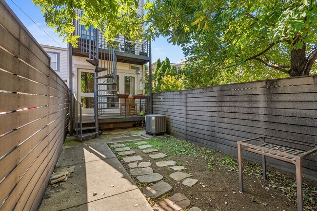 Building Photo - Stylish 2-Level Condo with Private Yard & Chef’s Kitchen Near Petworth Metro!