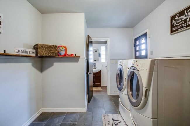 Building Photo - Spacious 4-Bedroom Home with Dual Living Areas