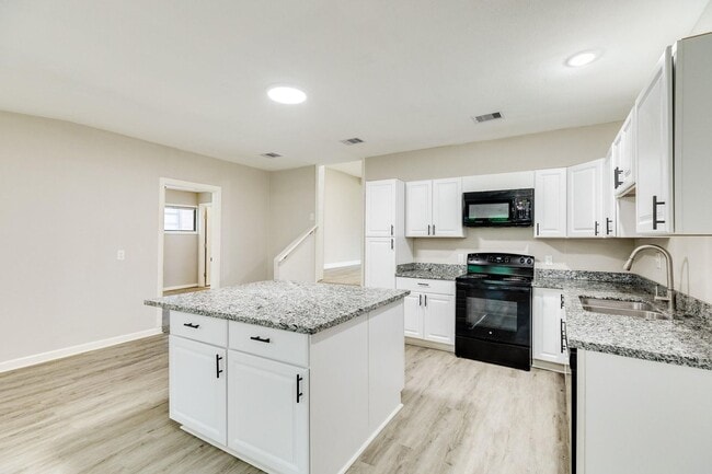 Building Photo - Recently Renovated 4-Bedroom Home with Mod...