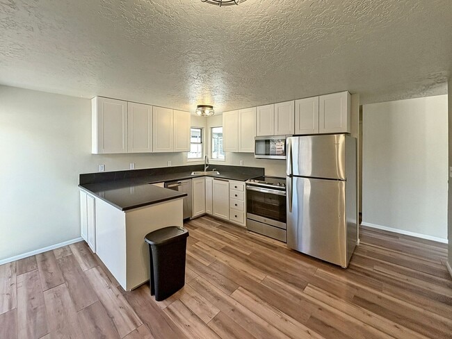 Building Photo - 3-Bedroom Boise Home with Outdoor Fireplace, Fenced Yard & LVP Flooring Near Downtown | $500 Off ...