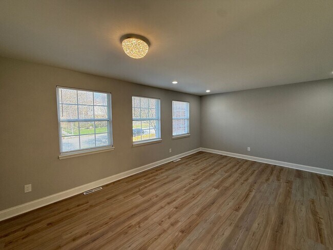 Building Photo - New Everything 4BR Townhome with Private Lower Level Suite | Stainless Kitchen | LVP + New Carpet...