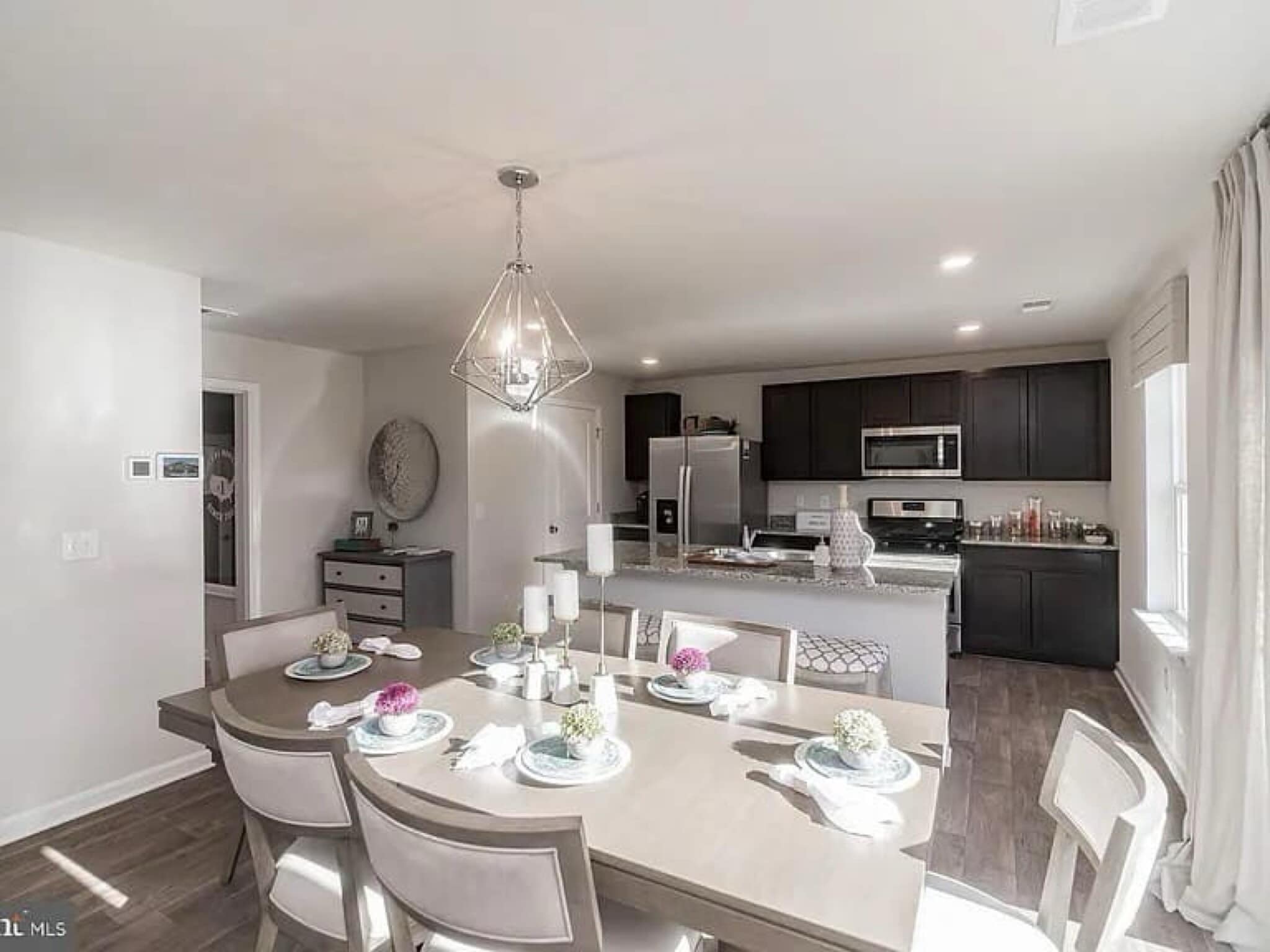 Open area between kitchen and living room for flexible use. - 377 Aylesbury Ln